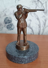 Bronze figurine of a Hunter on a stone. picture