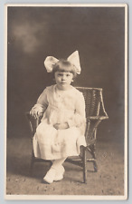 RPPC Little Girl In Studio White Dress Big Bow c1910 Real Photo Postcard picture