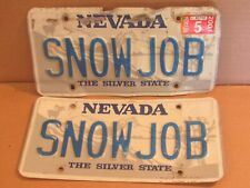 pair Nevada License Plate SNOWJOB vanity personalized expired picture