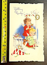 Vintage EVE ROCKWELL Cheerie Cherubs Getting Ready Angel Glitter Christmas Card picture