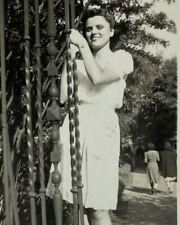 Pretty girl In White Dress Pose By Gate B&W Photograph 2.75 x 4.5 picture