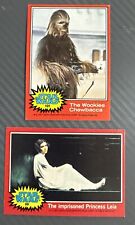 2 - 1977 Topps Star Wars Red Series Cards - LEIA & CHEWBECCA.Excellent Condition picture