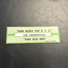1 JUKEBOX TITLE Strip Lee Greenwood God Bless The Usa /  This Old Bed Mca 45 picture