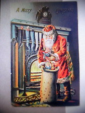 PC 192-7  CHRISTMAS POSTCARD - SANTA FILLING STOCKINGS BY FIREPLACE - EMBOSSED picture