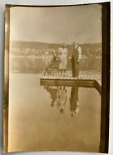 VINTAGE SEPIA PHOTO NEGATIVE - Reflection Photography Image - 3 people on dock picture
