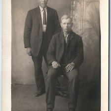 c1910s Handsome Two Men Portrait RPPC Short Tie Fake Studio Window Photo PC A213 picture
