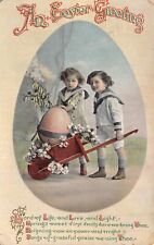 AN EASTER GREETING~BEAUTIFUL VICTORIAN CHILDREN-LARGE EGG IN WHEELBARROW-POSTCRD picture