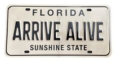 Florida Arrive Alive Black Tan Booster License Plate Sunshine State FHP Trooper picture