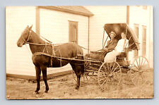 RPPC Older Couple Man Woman Driving Horse Drawn Buggy Carriage By Home Postcard picture