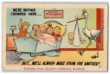 1943 Greetings From Sharon Springs Kansas KS Pelican Holding Baby Scene Postcard picture