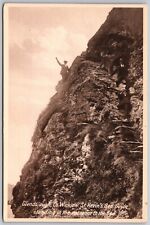 St Kevin's Bed Glendalough Ireland - Guide Standing in Entrance - Postcard 8369 picture