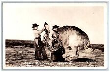 Larned KS Postcard RPPC Photo Earin Him Exaggerated Rabbit Down Rodeo Cowboy picture