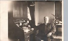 MAN IN HOME OFFICE INTERIOR real photo postcard rppc occupational ~HIDDEN TEAR picture
