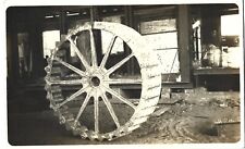 Massive 8-foot diameter solid cast drive wheel; 36 lugs; nice 1910-20s RPPC picture