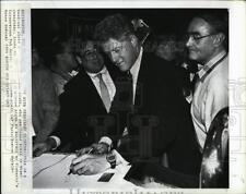 1994 Press Photo President Clinton signs back photo himself wall pub - RSM00847 picture