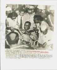 1955 Press Photo Egypt's Gamal Abdel Nasser signs autographs in Jakarta. picture
