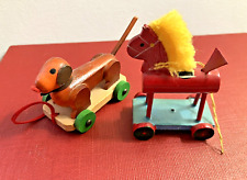 Two Handmade Vintage Christmas Wood Ornaments Horse w/ Yarn Mane & Dog on Wheels picture