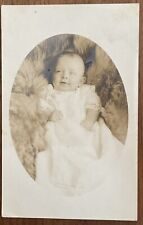 RPPC Baby In Gown, Lying In Fur, Postcard picture