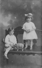 RPPC Boy & Girl Pose with Toy Elephant Adorable Real Photo Studio Postcard picture