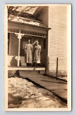 RPPC Two Woman on Porch of Snowy Home Postcard picture