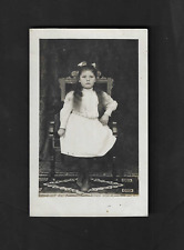 Real Photo RPPC postcard Girl sitting wood chair on designer floor picture