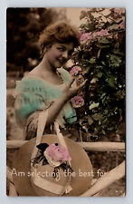 c1918 RPPC hand Colored Portrait of Young Woman Picking Roses Hat Postcard picture