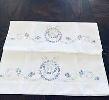 Hand embroidered pillowcases tiny blue flowers and lilac ribbon and bow Unused picture