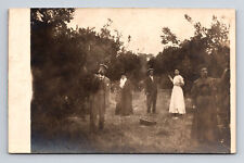 RPPC Well Dressed Family Picking Fruit in Orchard Apples Oranges? Postcard picture