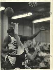 1984 Press Photo West Genesee basketball player James Cooney collides with #30 picture