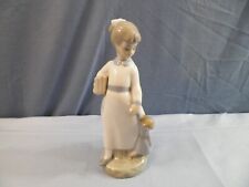 Zaphir Porcelain Figurine - Girl With Books & Baby Doll picture