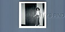 FOUND B&W PHOTO N+1961 PRETTY WOMAN IN DRESS POSED BY DOOR SMILING picture
