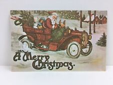 c. 1981 Christmas Postcard Santa in Car Toys tree Snow picture