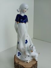 Porcelain figurine of a girl and a dog picture