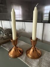A Pair Of Copper Candle Holders picture