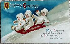 Clapsaddle Christmas Postcard~Three Snow Babies Ride Red Sled Down Hill in Snow picture