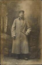 WWI German soldier studio portrait trench coat ~ RPPC real photo postcard picture