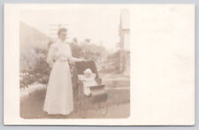 RPPC Real Photo Postcard Woman Victorian Baby Carriage Telephone Pole picture