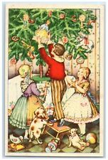 c1910's Christmas Tree Children Decorating Dolls Candle Lights Antique Postcard picture