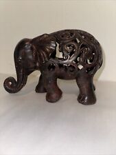 Decorative Carved Elephant Sculpture Open Work Dark Wood Tone Trunk Curved Up picture