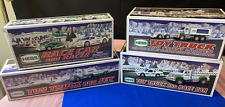 Hess Toy Trucks Lot of 4 -  NEW IN BOX  - 2008, 2009, 2010, 2011 picture