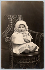RPPC Portrait Postcard~ Bundled Up Infant Child Sitting In Wicker Chair picture