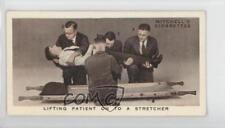 1938 Mitchell's First Aid Tobacco Lifting Patient on to a Stretcher #22 0f8 picture
