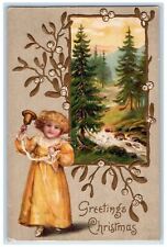 c1910's Christmas Greetings Girl Ringing Bell Pine Tree Winter Embossed Postcard picture