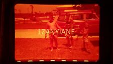 BL06 ORIGINAL KODACHROME 35MM SLIDE FAMILY STANDING IN YARD SHOWING FISH CAUGHT picture
