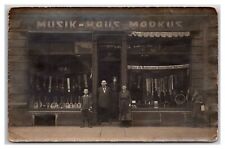 MANNHEIM GERMANY RPPC ~ Musical instrument store front w Family Markus Musik picture