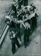 Members of the crew of H.M.A.S. Australia carry... - Vintage Photograph 4933925 picture