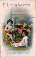Easter Girls Colored Eggs Chair Basket Fireplace Embossed c1910 postcard P7 picture