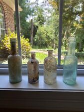 4 Antique bottles with heavy irridescence on 3. picture