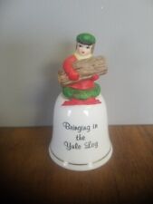 Vintage 'Bringing in the Yule Log' Porcelain Christmas Bell picture