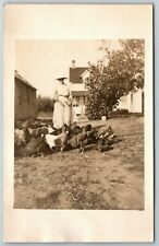 Vintage c1910-15 PPC Postcard - Woman Feeds Hens Chickens in Front of House picture